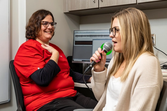 A student talking on a microphone
