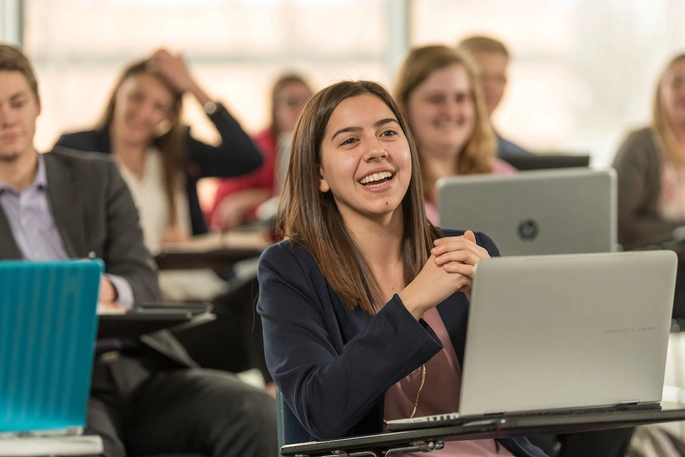 Beacom student sitting in class.