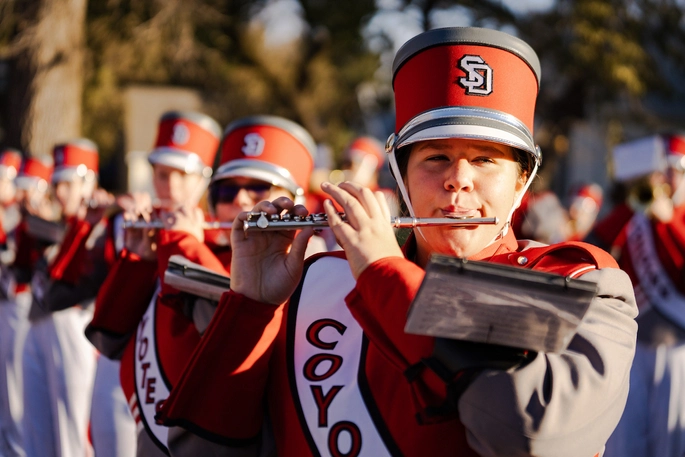 A flutist in the USD marching band