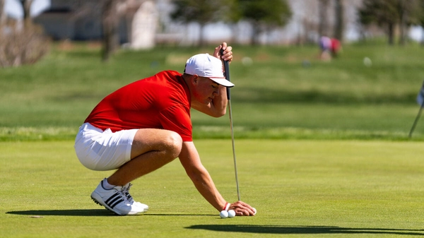 A male Coyote golfer