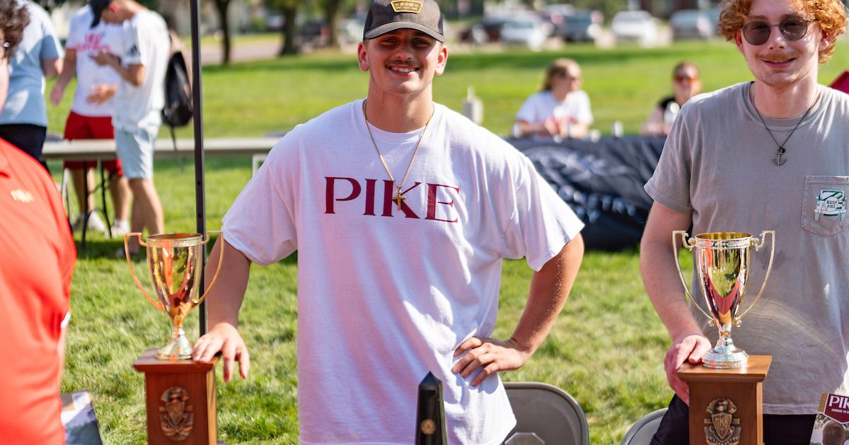 A member of Pi Kappa Alpha outside.
