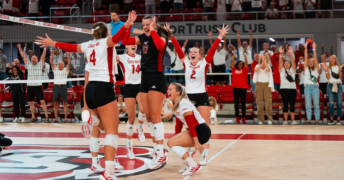 USD volleyball team cheering at the SCSC.