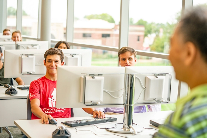 Computer science students sitting in class.