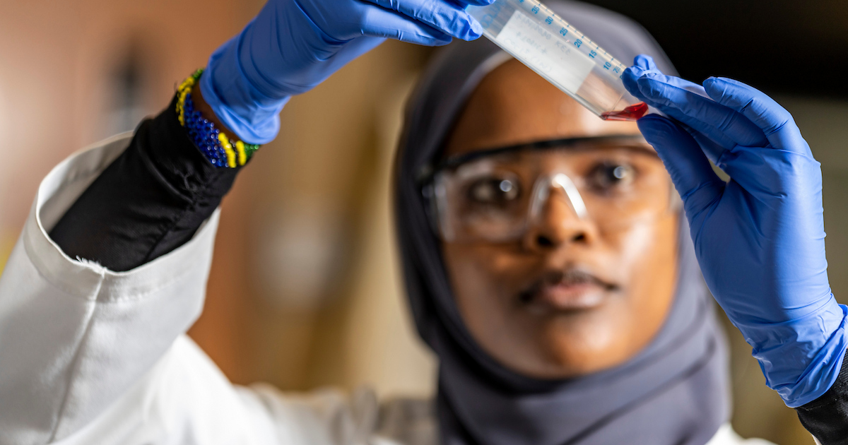Chemistry student working in a lab.