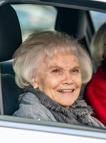 Nancy McCahren riding in a vehicle during a Dakota Days parade.