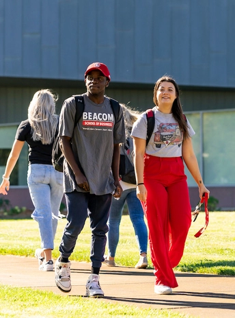 Students walking by the Beacom School of Business