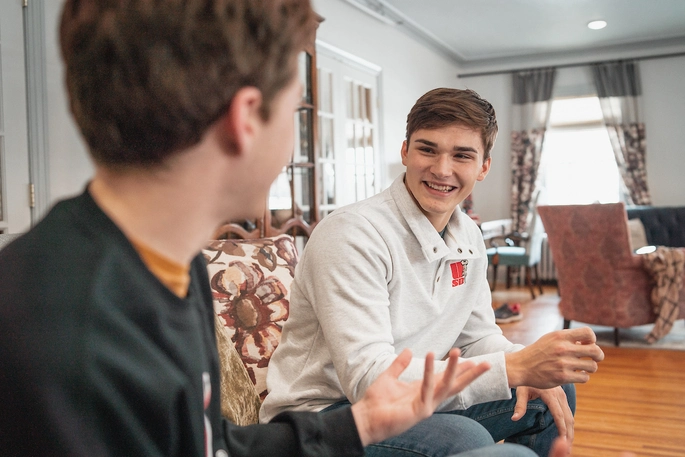 Students talking on a couch