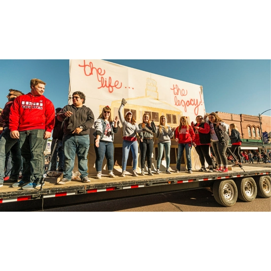 Dakota Days throwback of a group of students riding in the parade