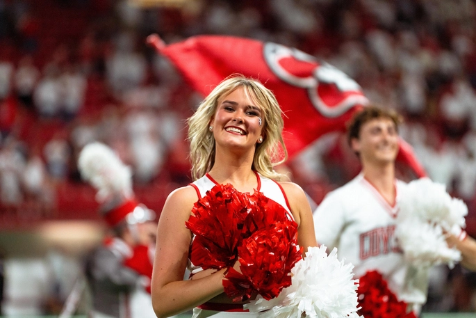 Dance team member in the DakotaDome performing at a game