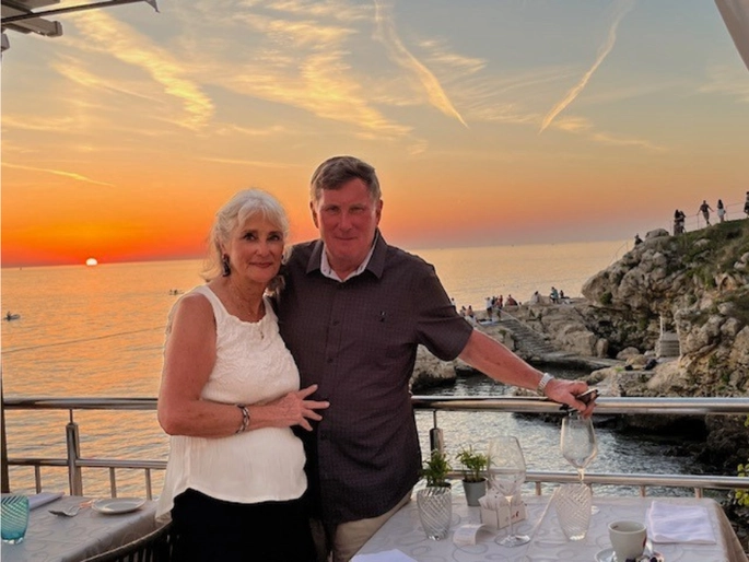 Gordan and Marie Moore posing by a lake