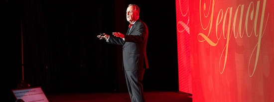 James W. Abbott presenting at an event