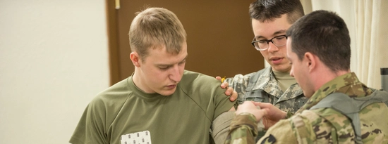 ROTC cadets practice tourniquets