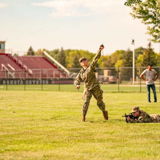 ROTC cadet practices grenade throwing