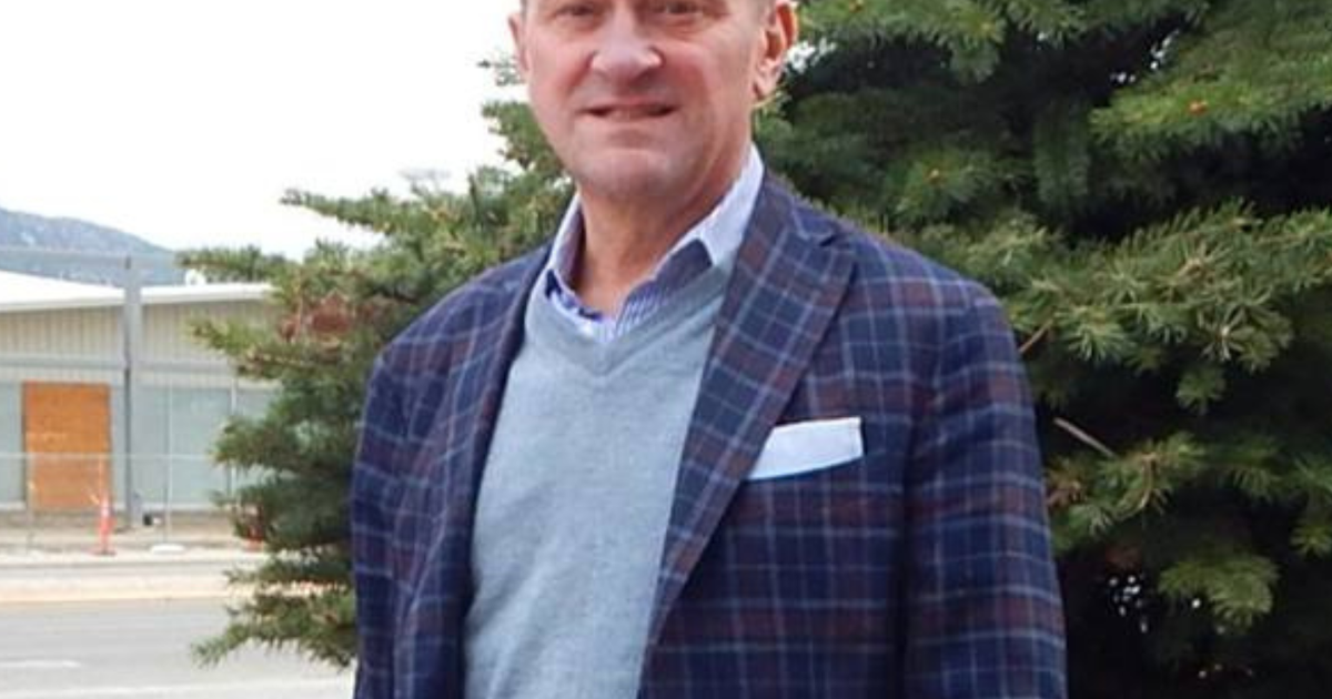 Ty Inglis standing in front of a tree.