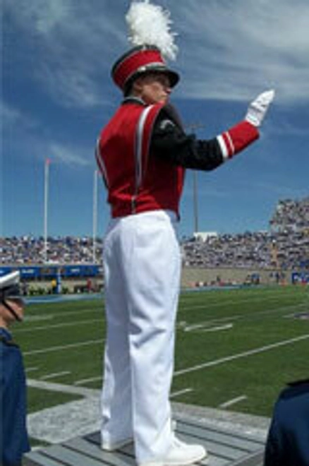 Nicole Decker as a USD student, conducting the marching band.
