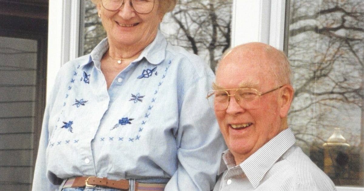 Young and Gwen Moore posing on their porch